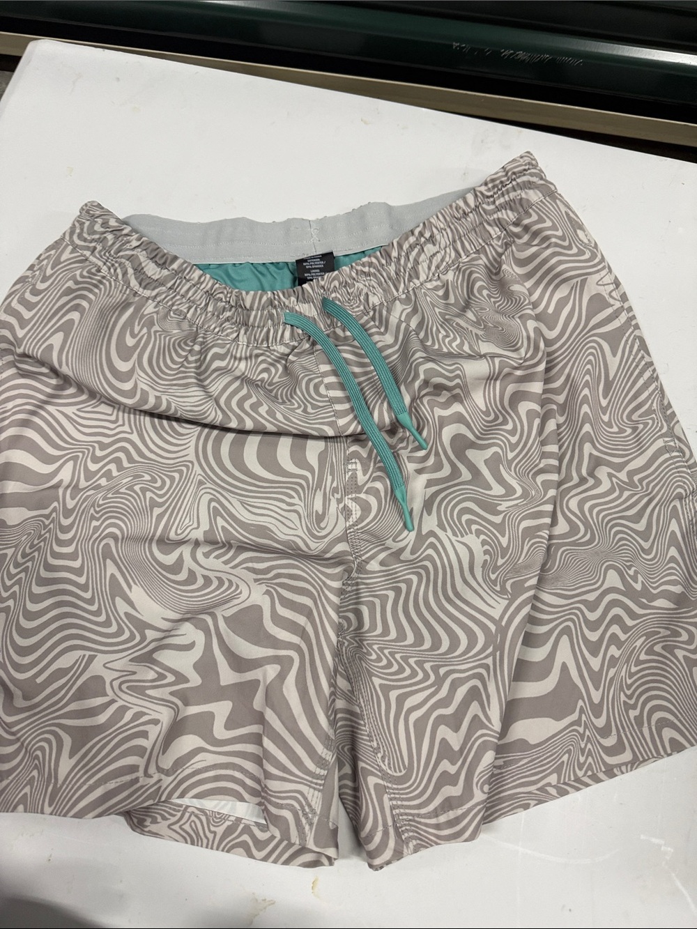 Neutral Wave-Print Athletic Shorts with Teal Drawstring